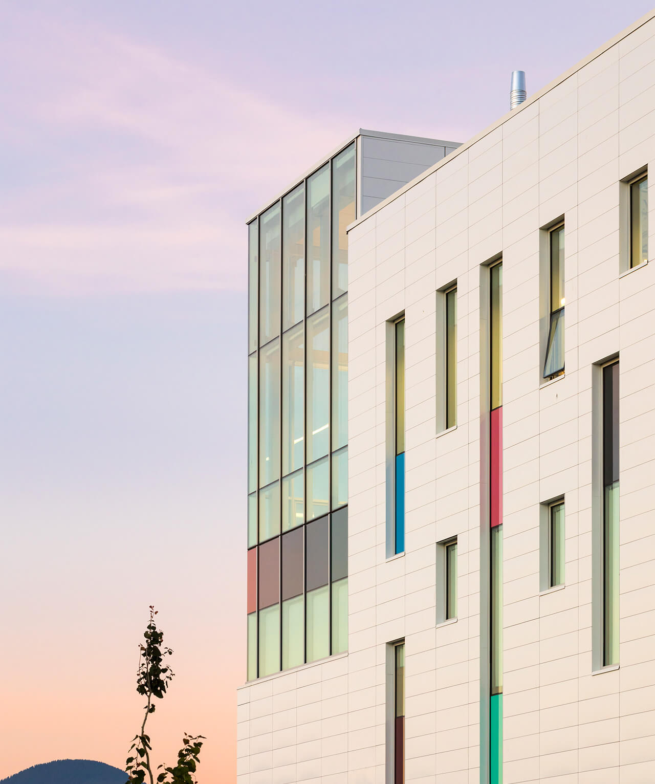 The colourful exterior of a building during sunset.