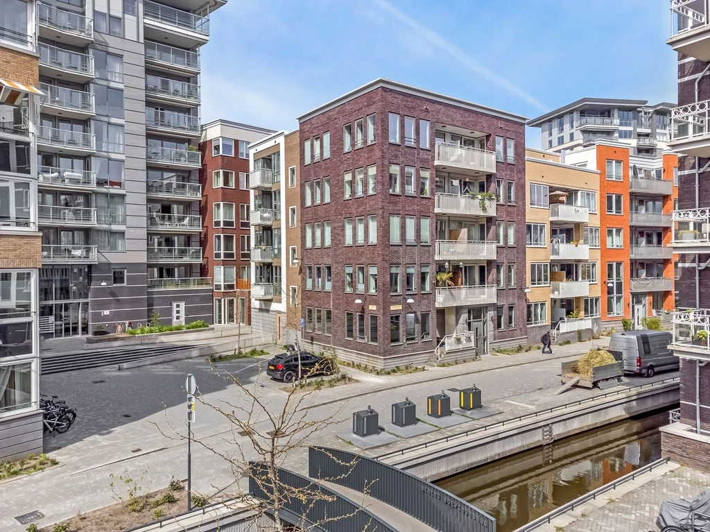 Modern apartment blocks beside a railway line