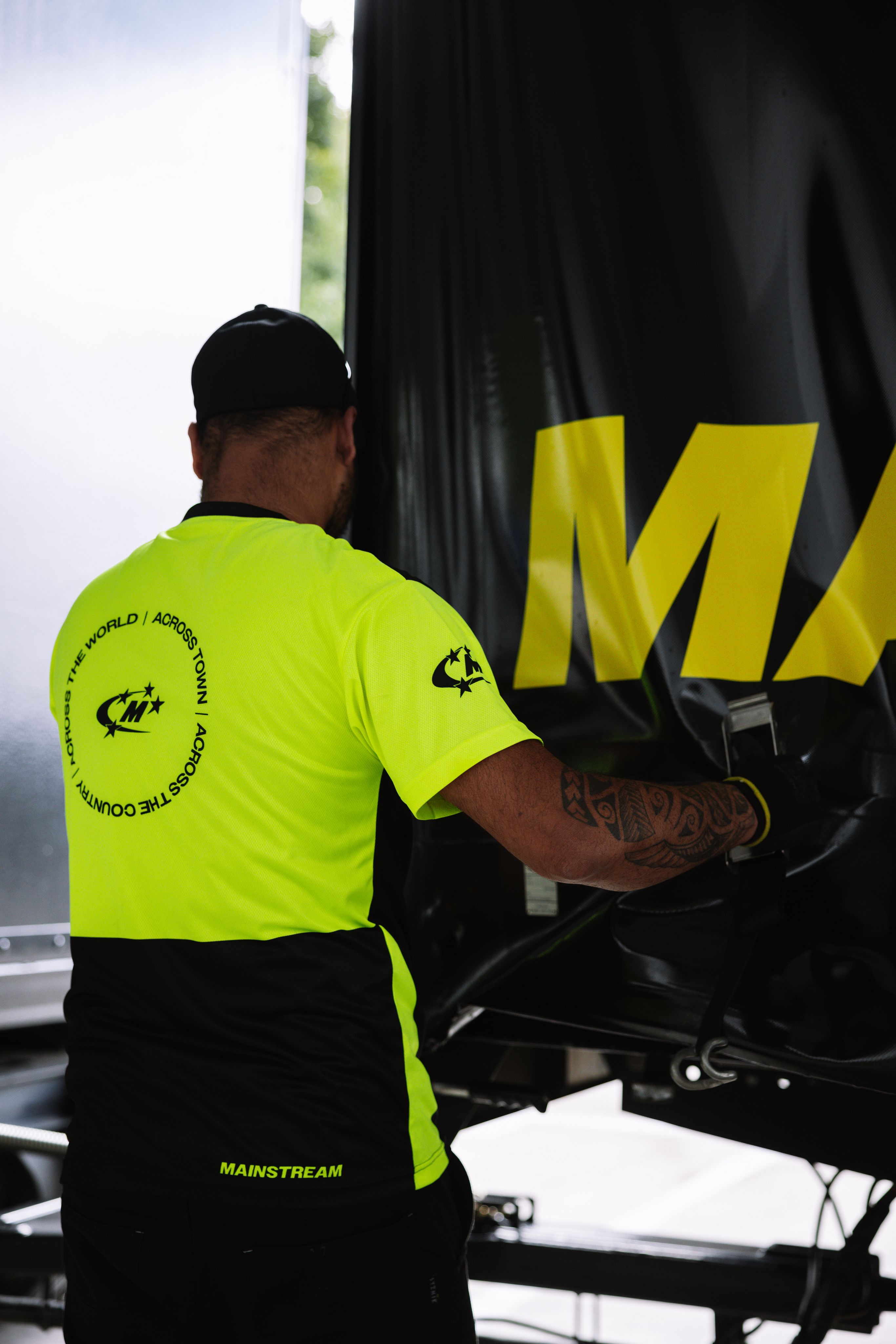 Man carrying a package outside a building