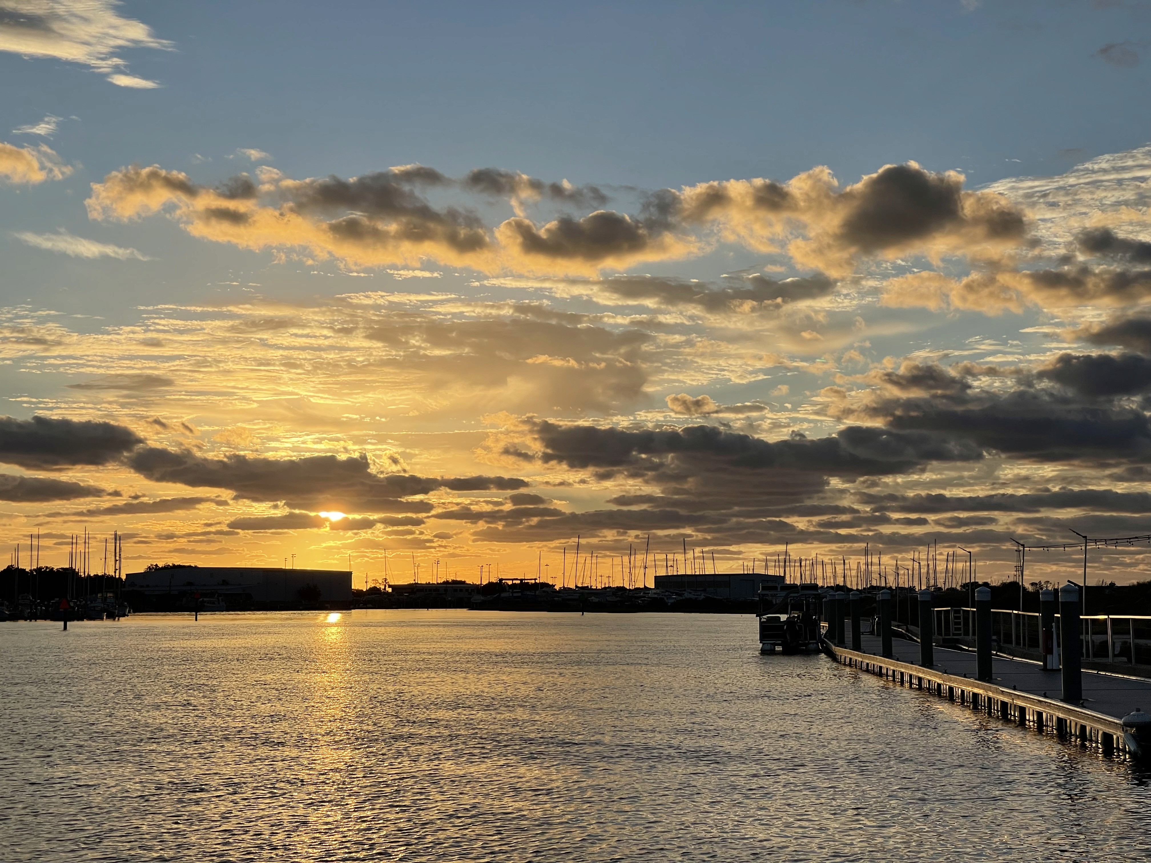 sunset view of water and dock at St. Augustine Shipyard