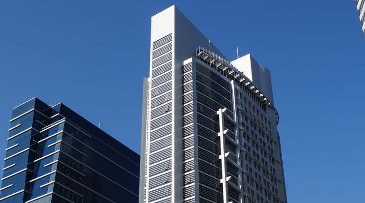 Sleek exterior of a high-rise commercial building, showcasing available corporate units in Silver Tower.