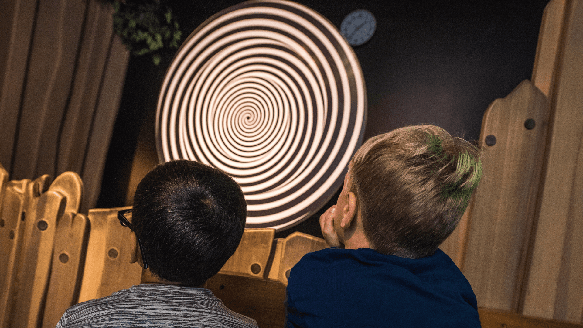 Two young boys watch the trizonal space warper.