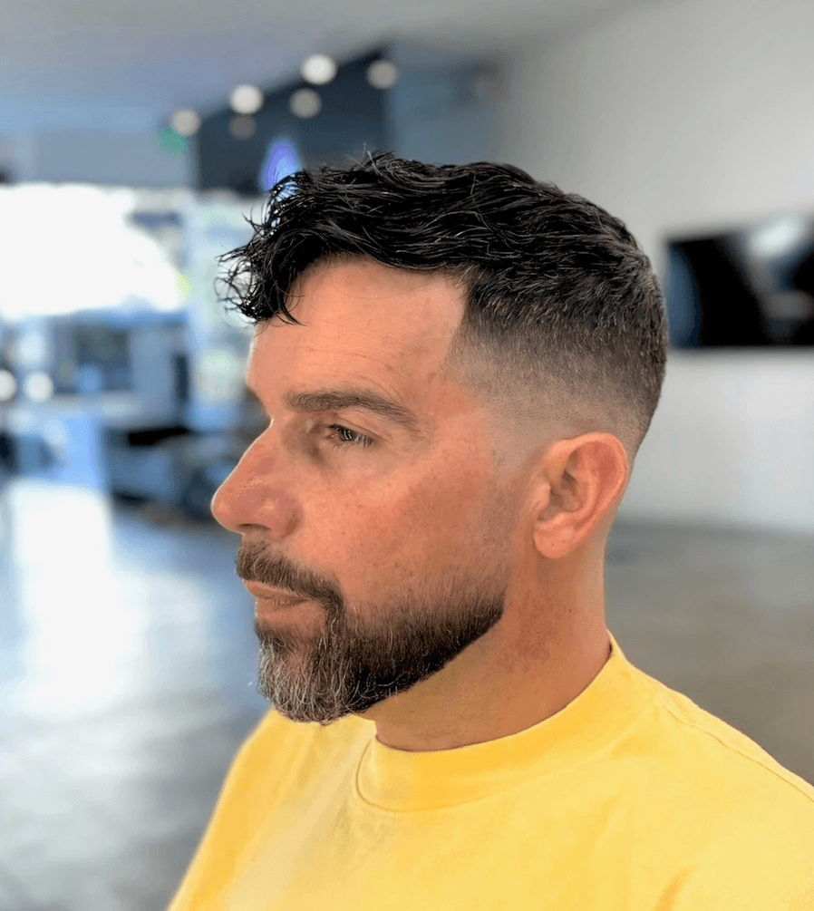 Professional fade with detailed texturizing, ideal for a clean and modern men’s style. Courtney Palmore