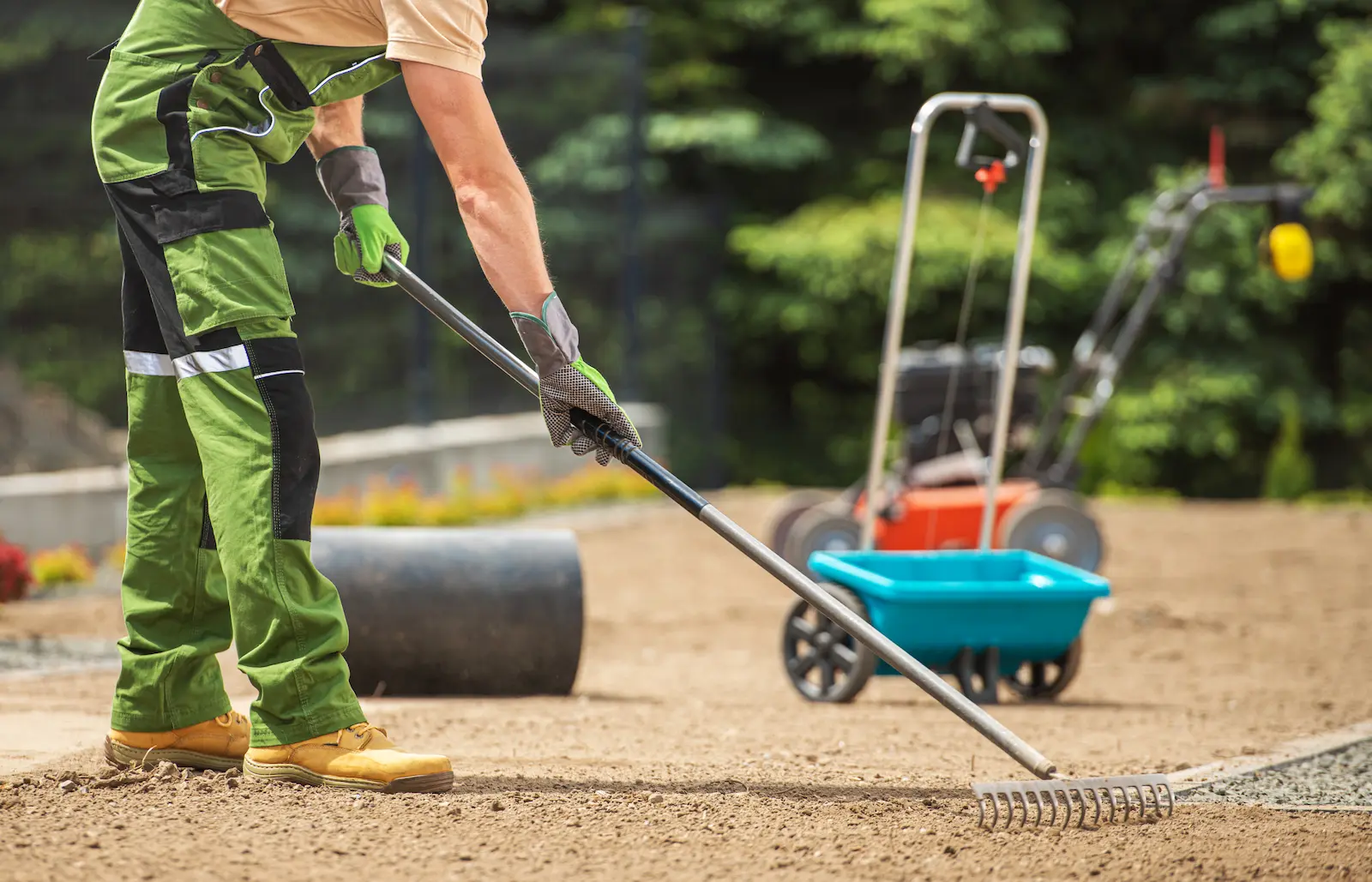 worker performing full spring clean up in yard