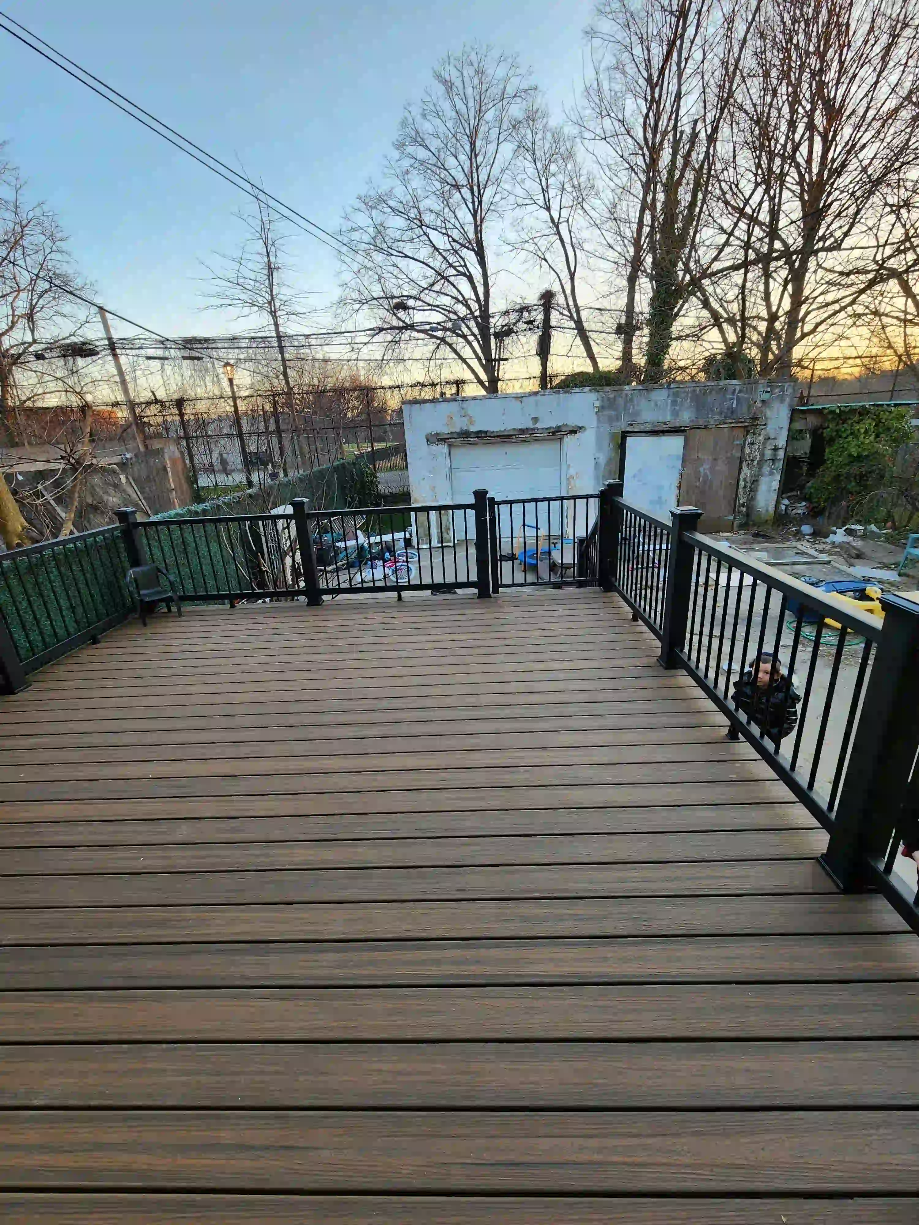 A beautiful backayrd deck surface built by using Trex Toasted Sand deck boards in Borough Park, Brooklyn completed by Jewel Construction