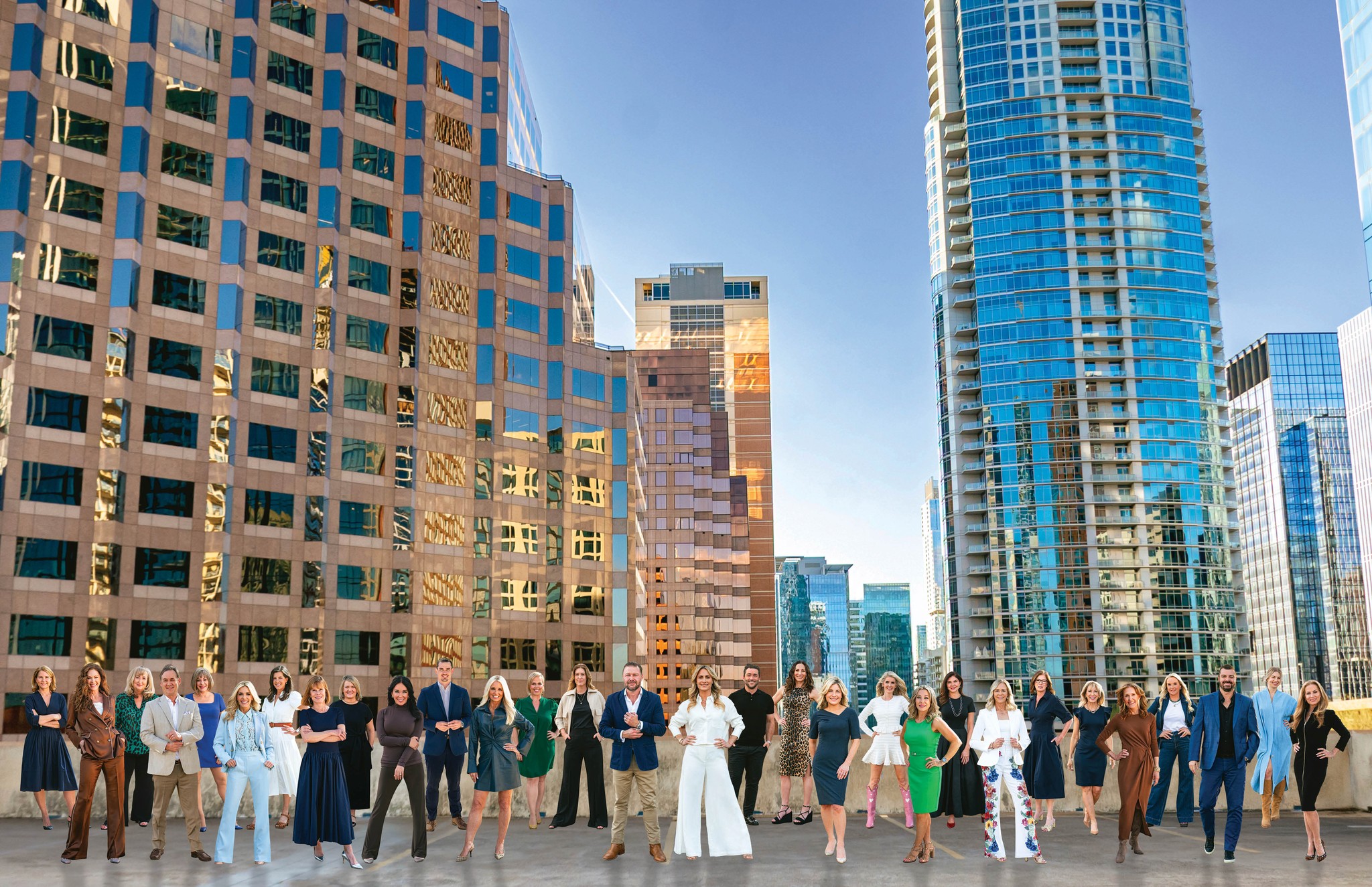 woman holding a phone and man looking at the phone. both are smiling