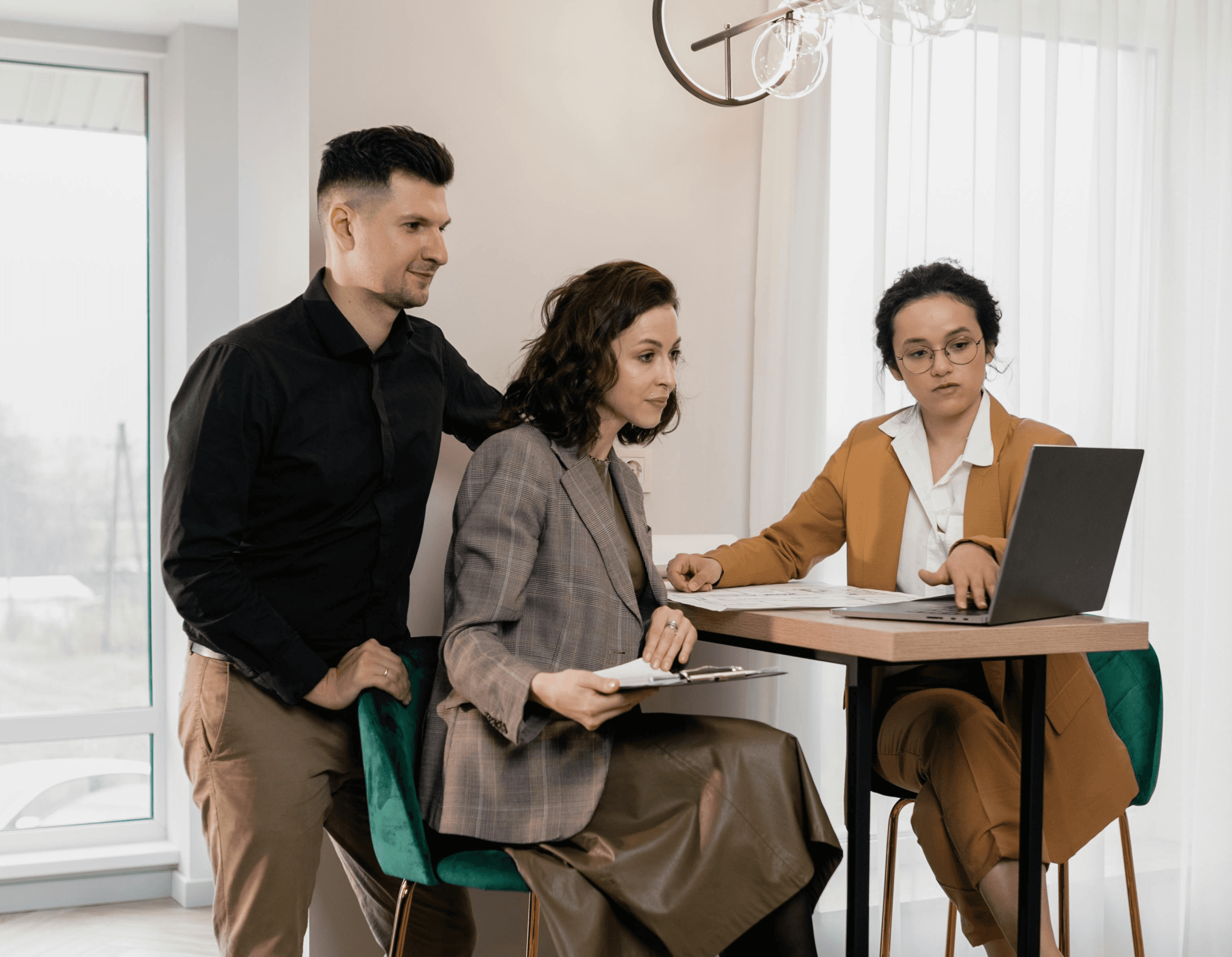 A man and a woman consulting with a property agent