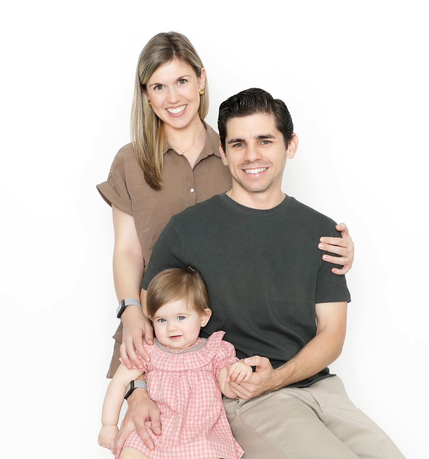 Mahvin Photography couple photoshoot Dubai featuring a family posing together with their cute baby girl..