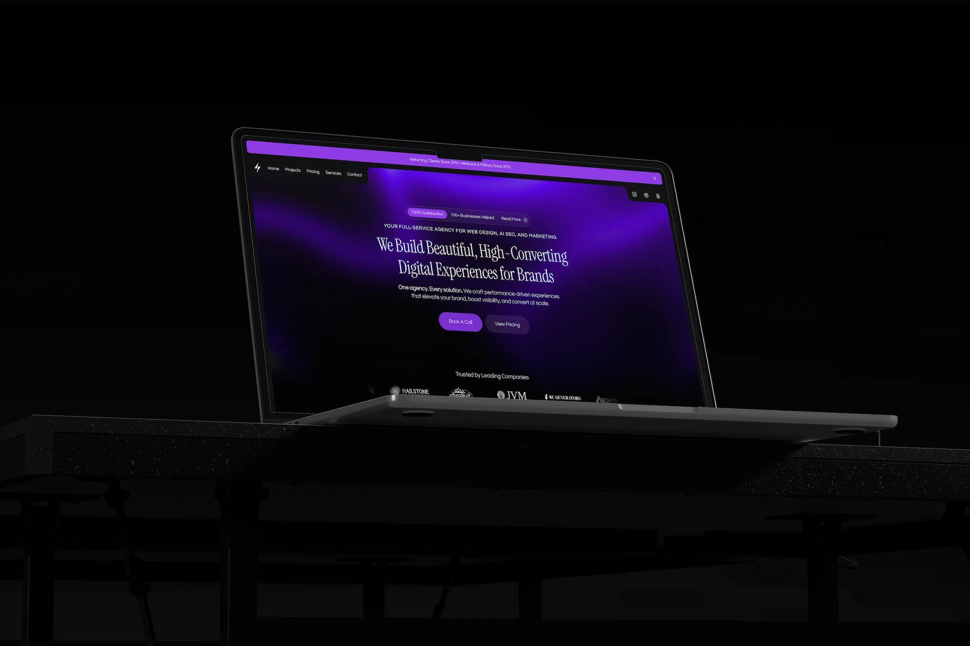A modern laptop displaying a sleek, high-contrast website homepage with a dark purple theme for Nextus Digital Solutions, focusing on web design, AI SEO, and digital strategy.