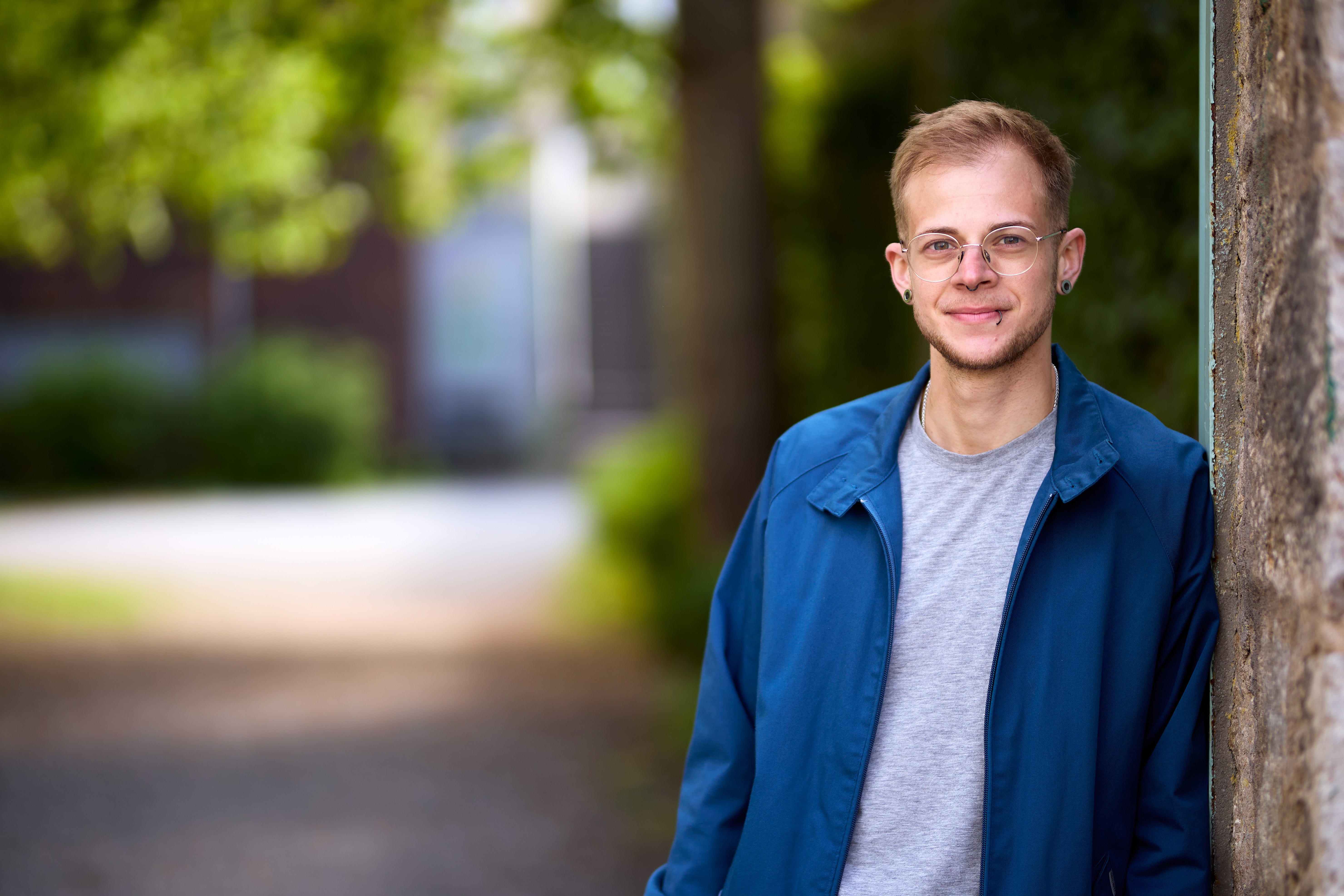 man on ladder welding post