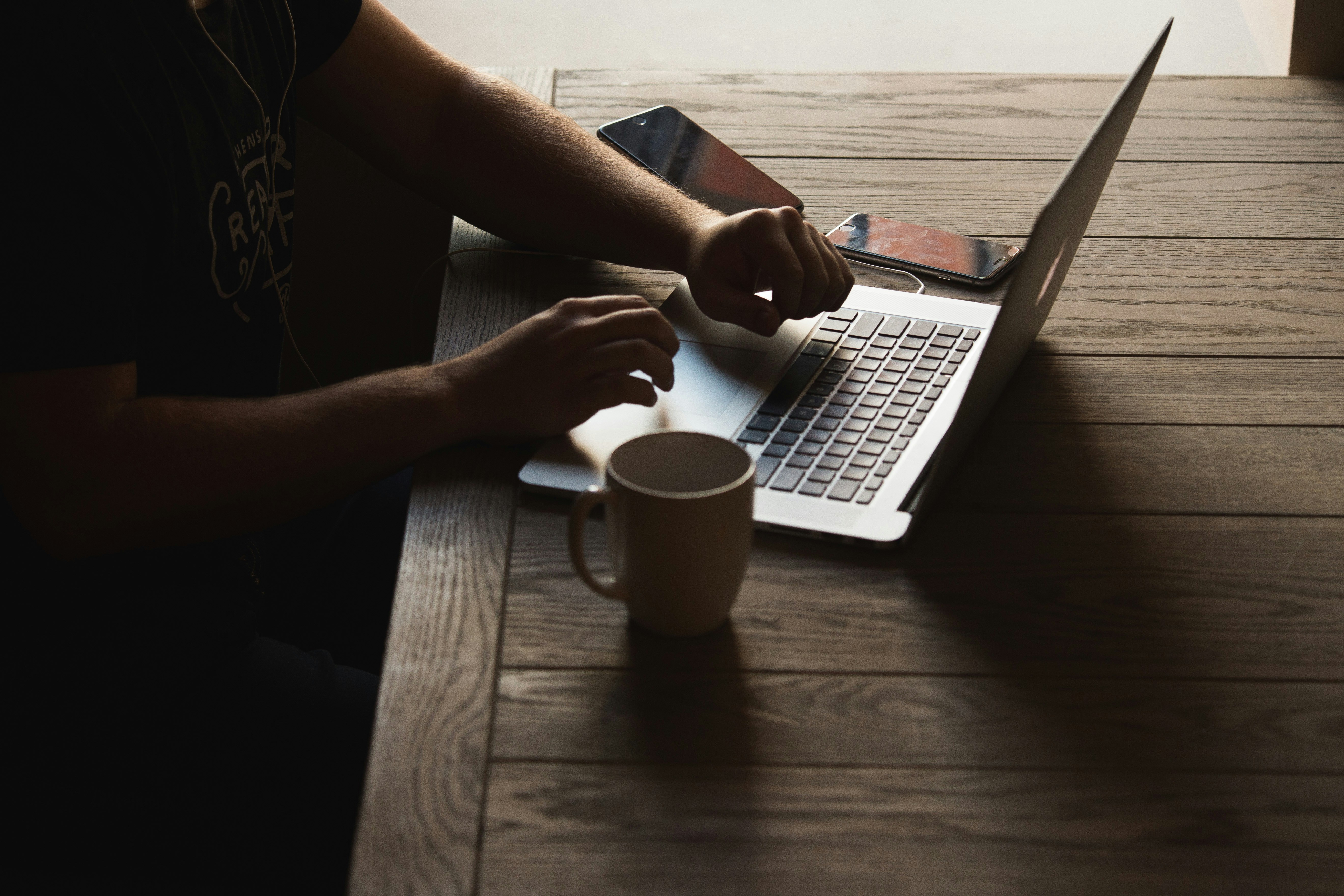 person sitting on desk -  Bitcoin Trading Strategies