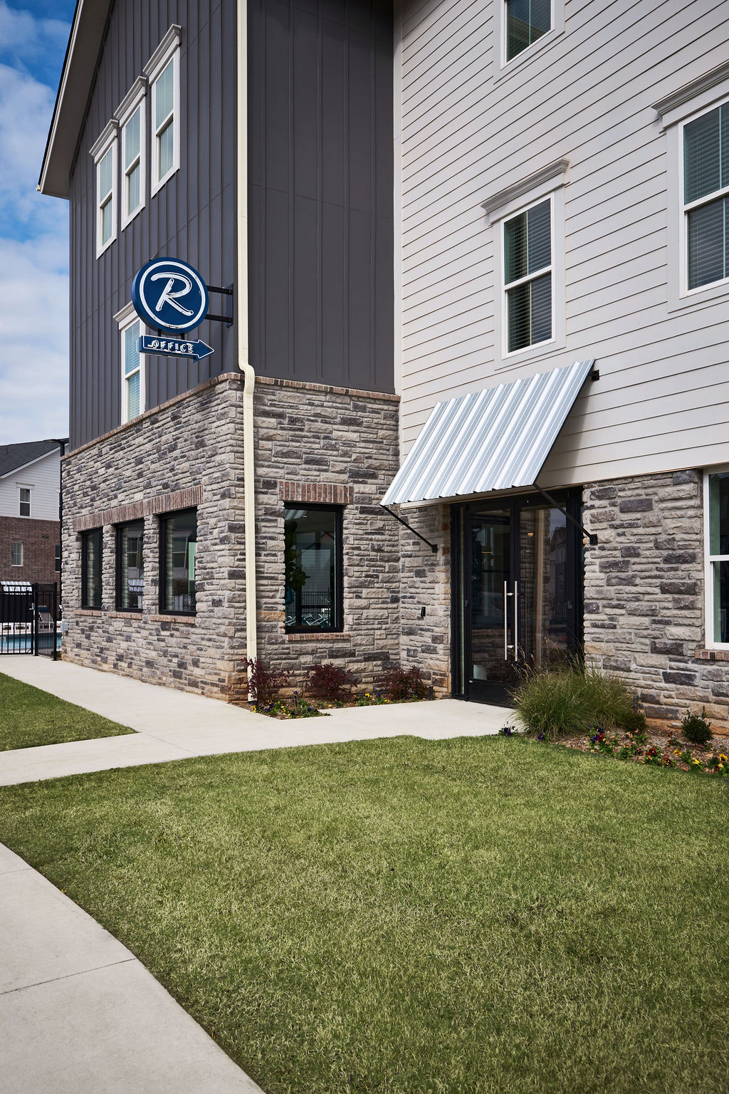 Primary bedroom bed, side table and lamp