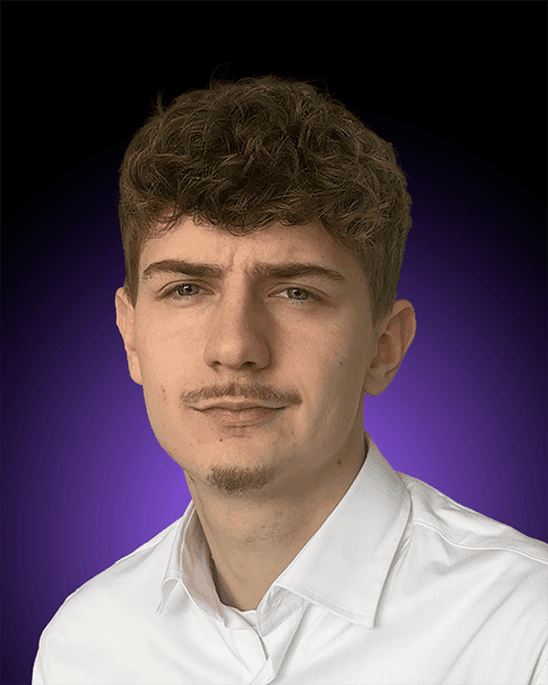 headshot of male in dark background