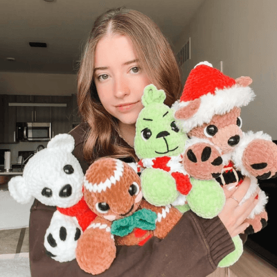 A man with brown hair and glasses looks sideways with a curious expression, standing against a vibrant yellow background while wearing a matching yellow shirt.