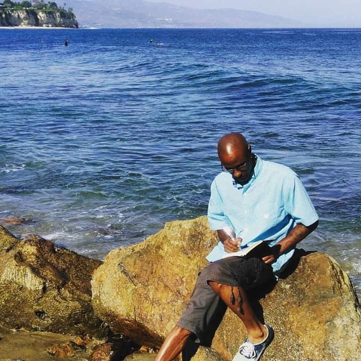 A cozy garden corner featuring potted herbs, a wooden bench, a watering can, and a wicker basket with towels, creating a serene and natural outdoor vibe.