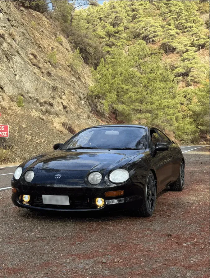 gray mercedes benz coupe on black asphalt road during daytime
