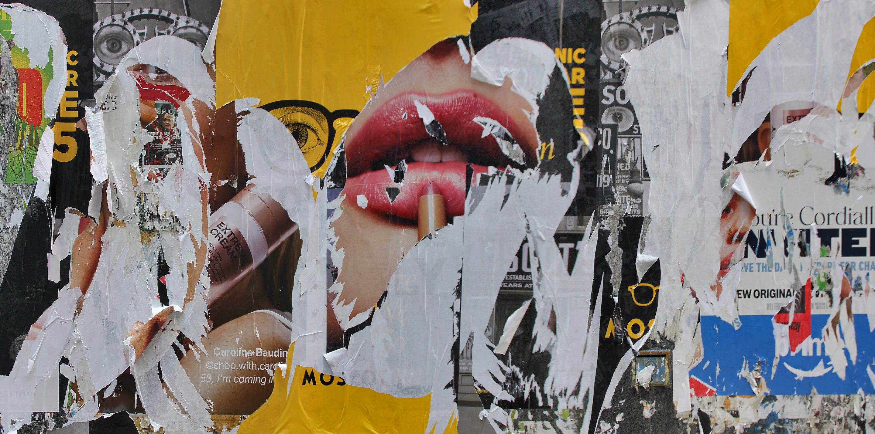 Photograph of layered torn posters revealing fragments of faces, red lips, and advertising text beneath peeling paper. Bold yellow, black, and white areas create a visually dense collage that explores beauty, consumption, and disintegration.