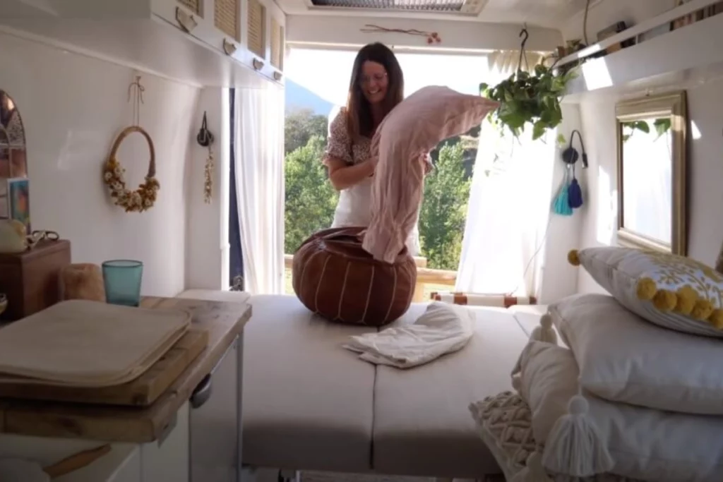 Rugs and cushions in small campervan