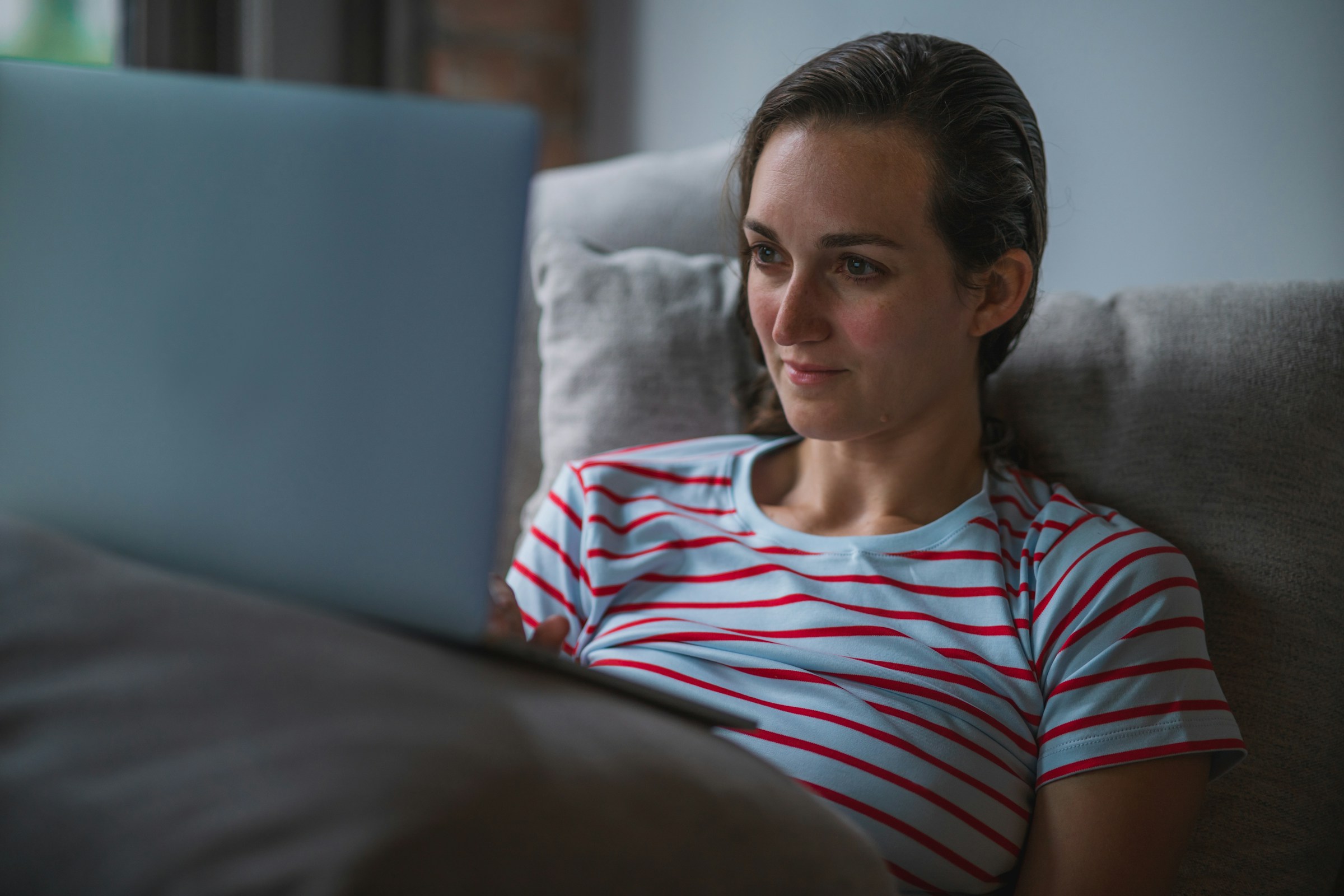 person sitting on sofa and working - Summarize Research Paper ChatGPT 