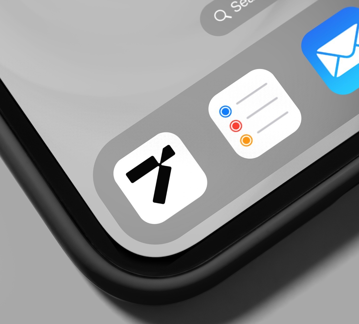 Close-up of a smartphone screen showing app icons, including a navigation or mapping app.