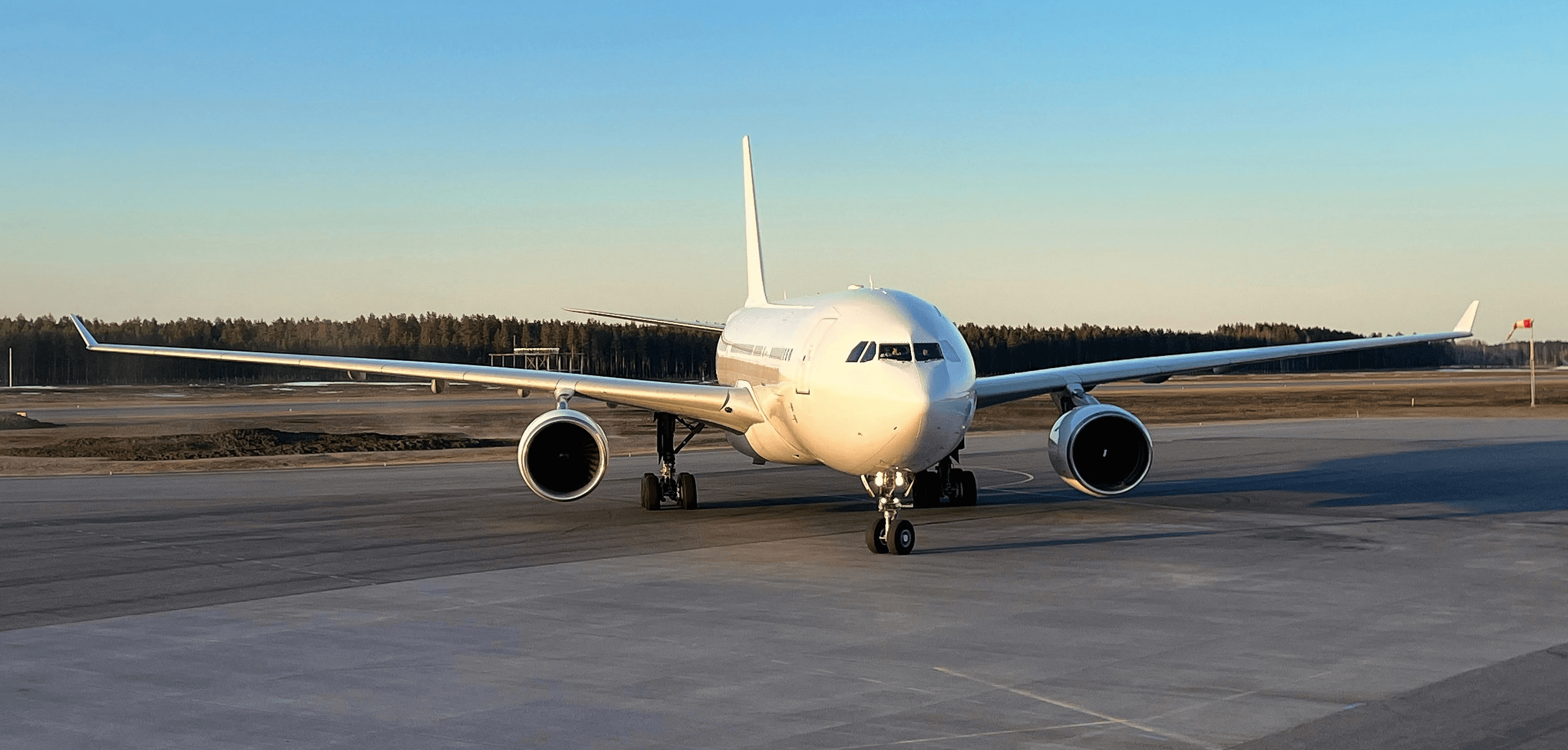 a large jetliner sitting on top of an airport tarmac