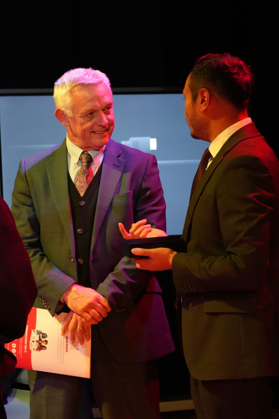boy in black hoodie sitting on chair