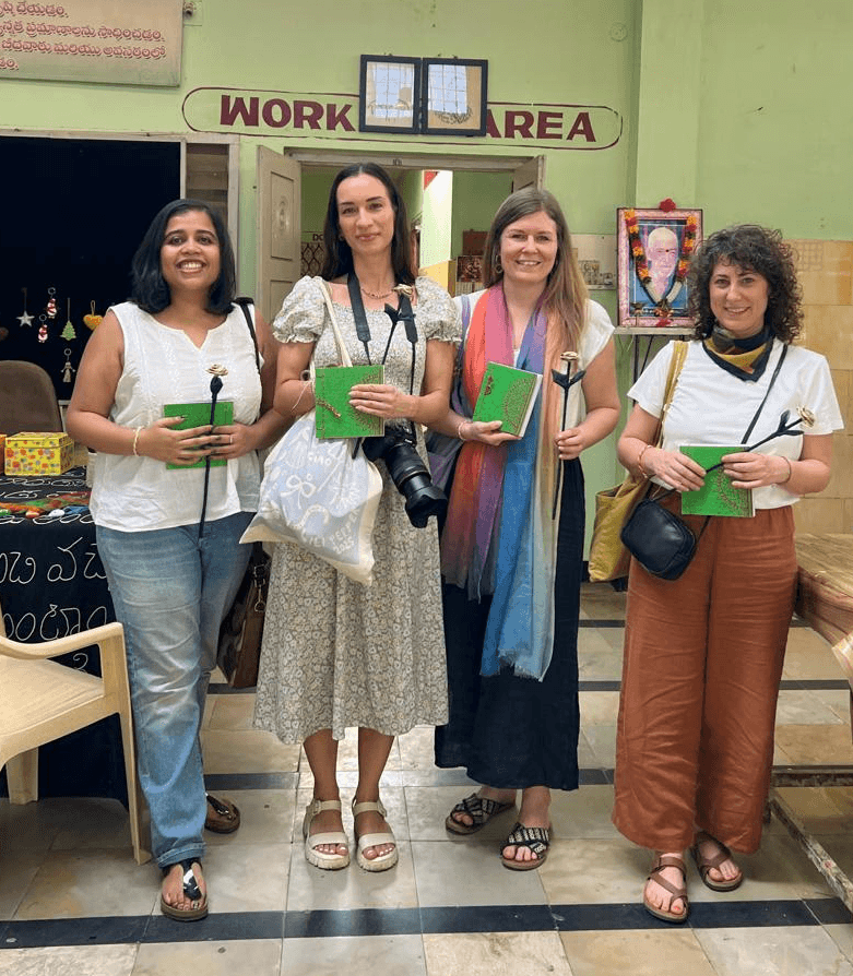 man with glasses smiling fully