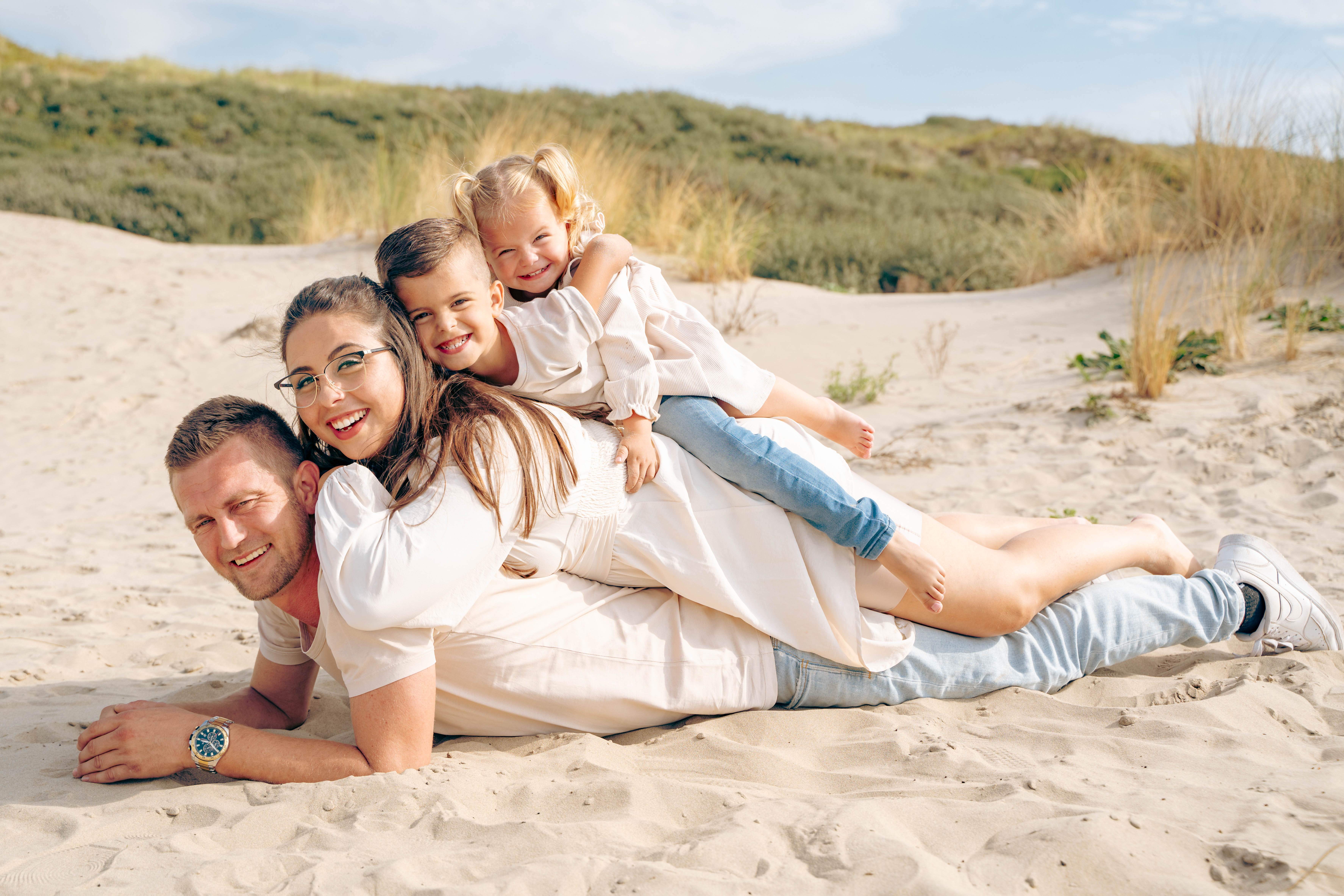 A couple in formal wedding attire embraces intimately in a vast.