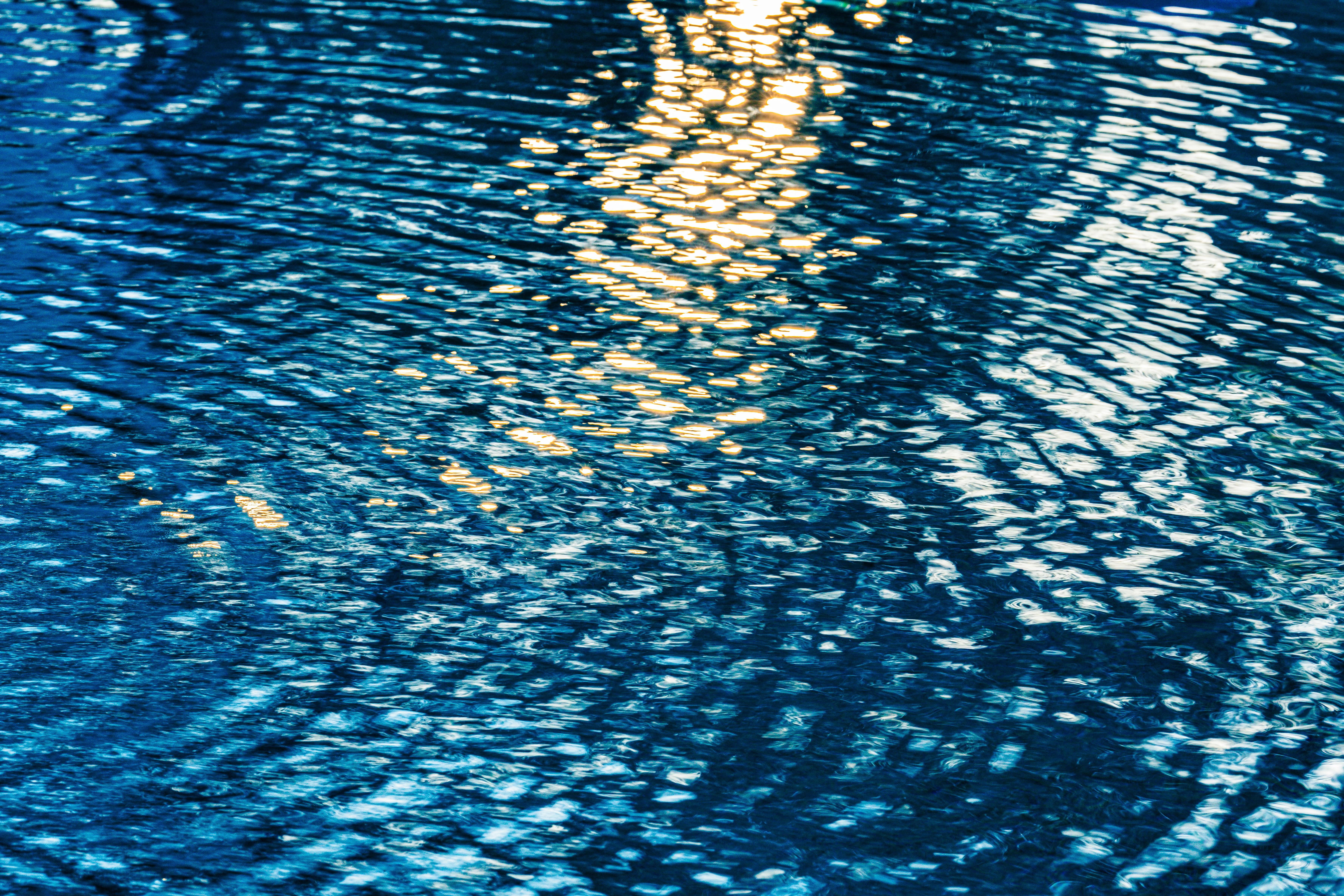 A man riding a surfboard on top of a body of water