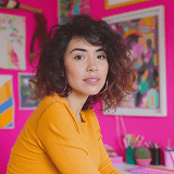 Female designer in colorful creative office environment