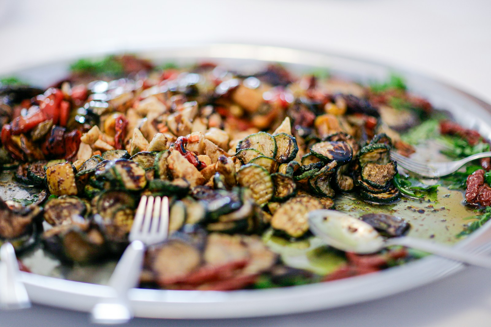 A platter of grilled vegetables with herbs and nuts, illustrating a whole-diet pattern rather than a single fertility food.