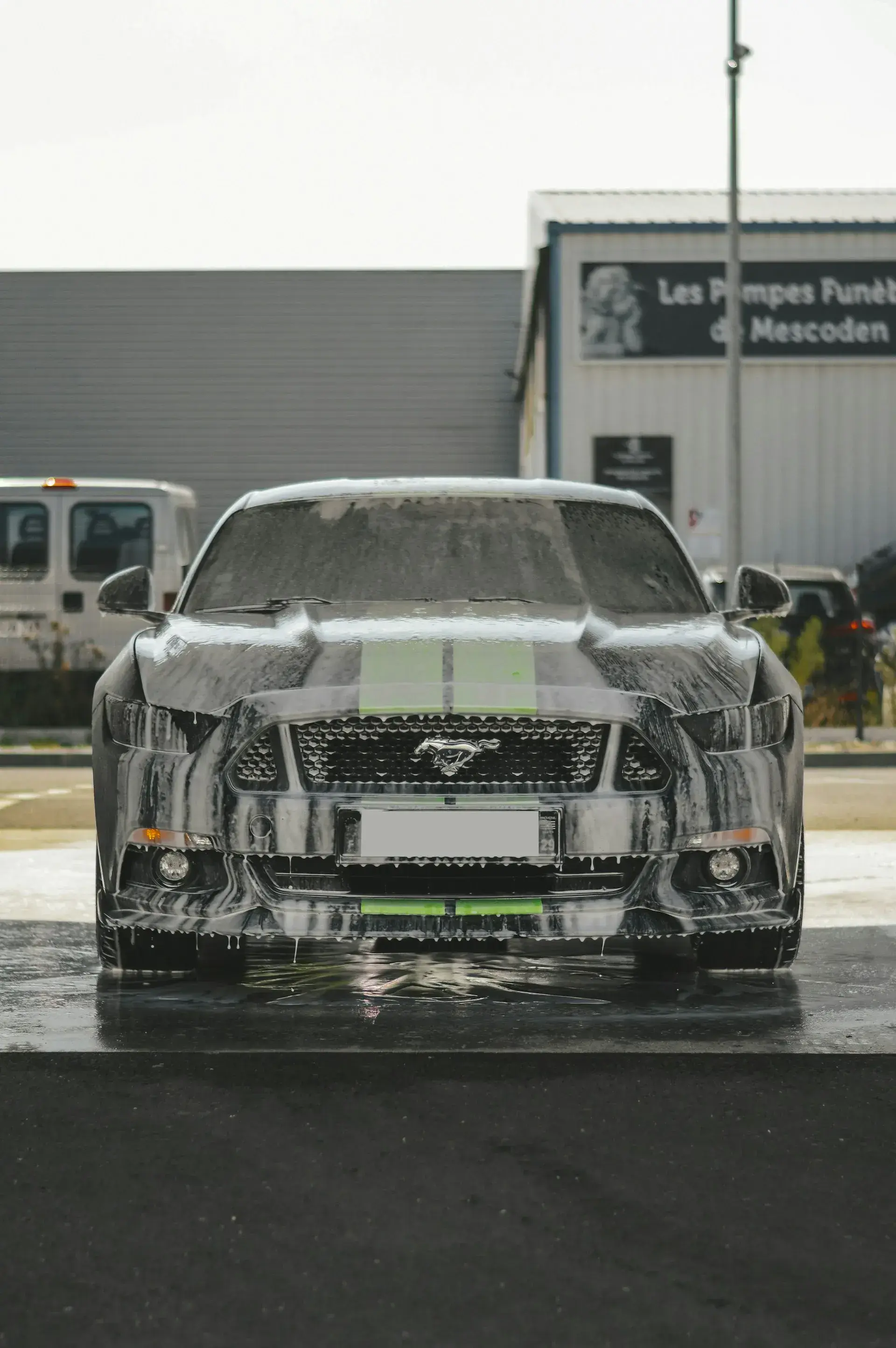 front view of a sports car with foam dripping off