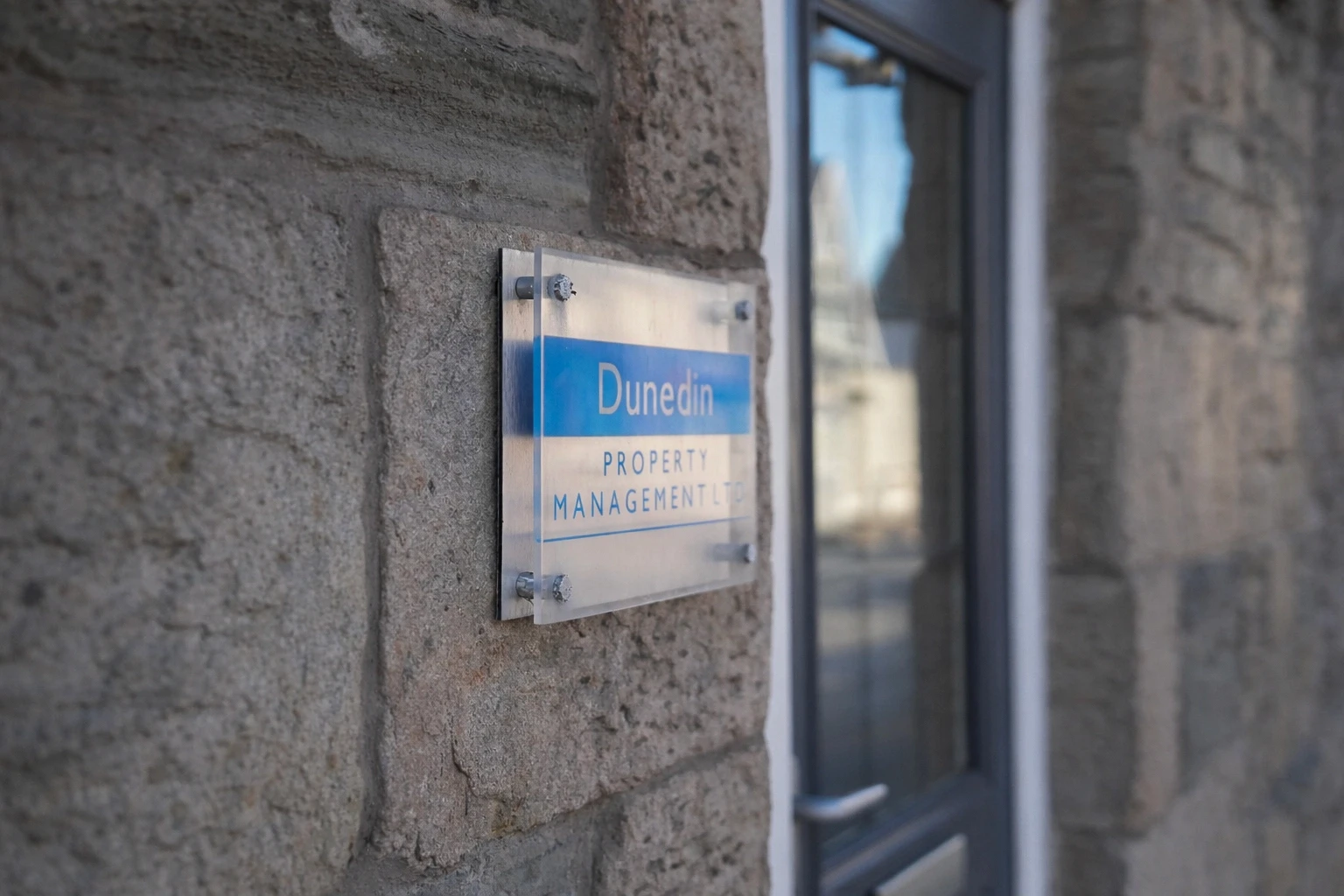 Dunedin reception sign with company branding