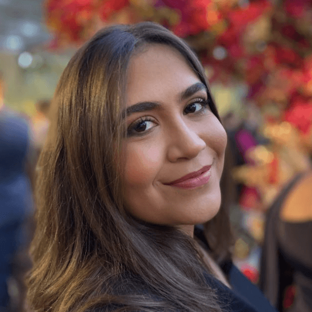 a man in a blue suit posing for a picture