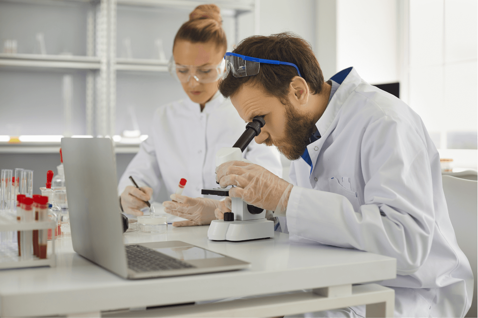 man in blue dress shirt sitting beside man in blue dress shirt