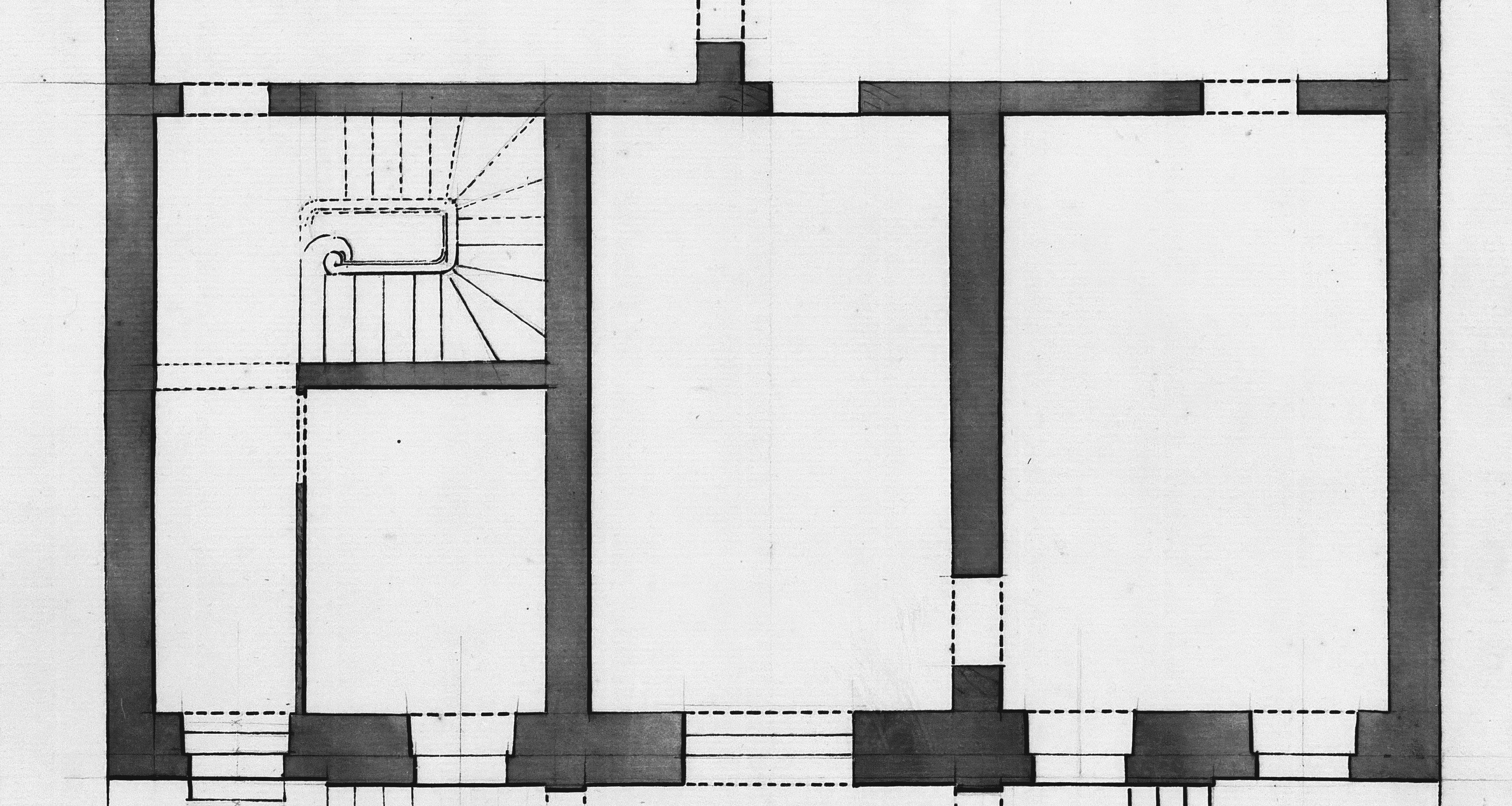 Architectural floor plan of a building with rooms and stairs.