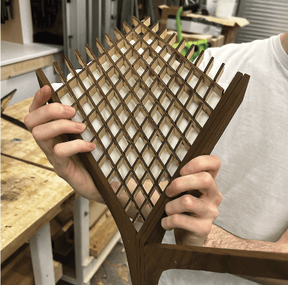 The hyperbolic structure is laser cut out of plywood, with the ash primary structure.