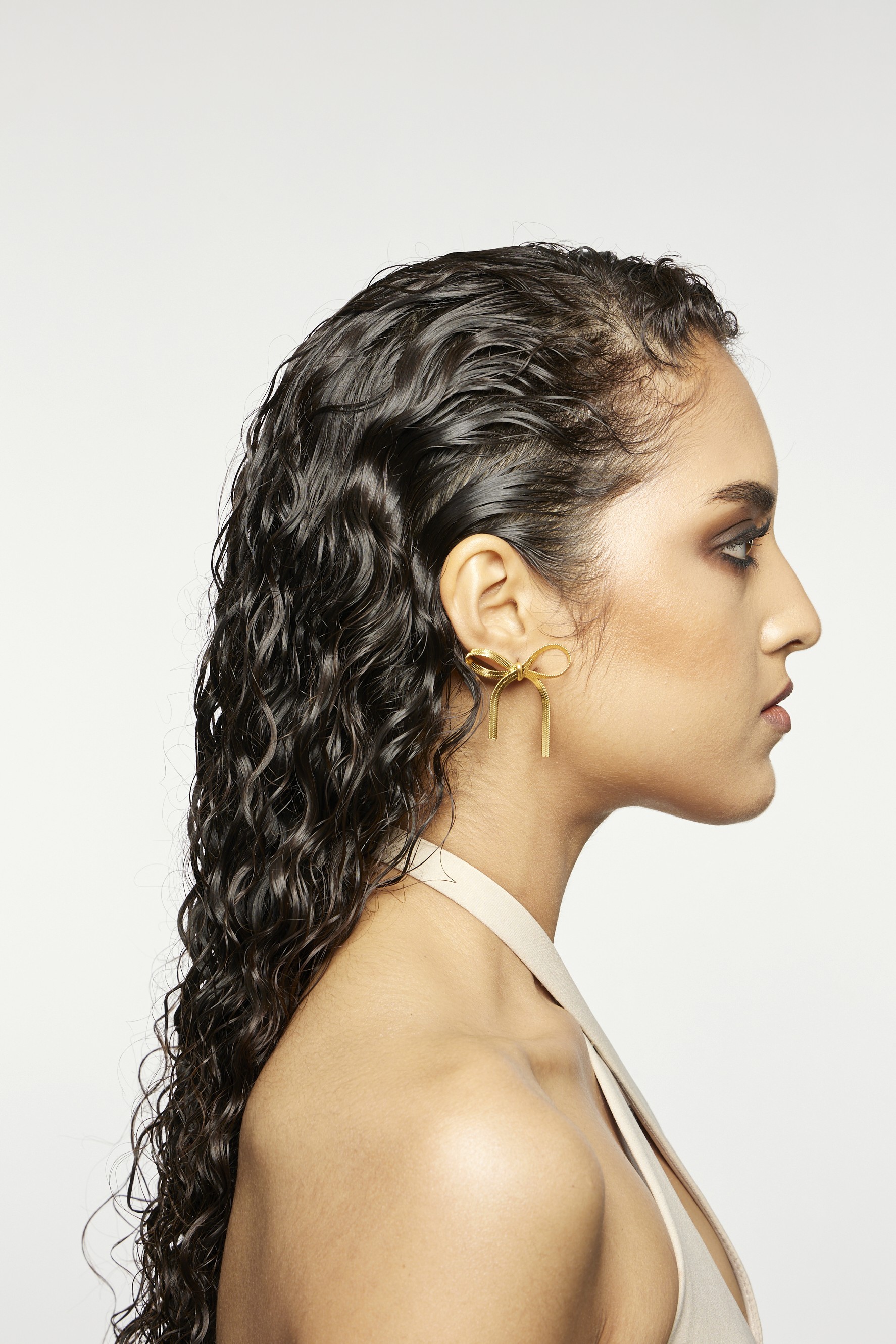 Group of friends smiling on a lively city street at night