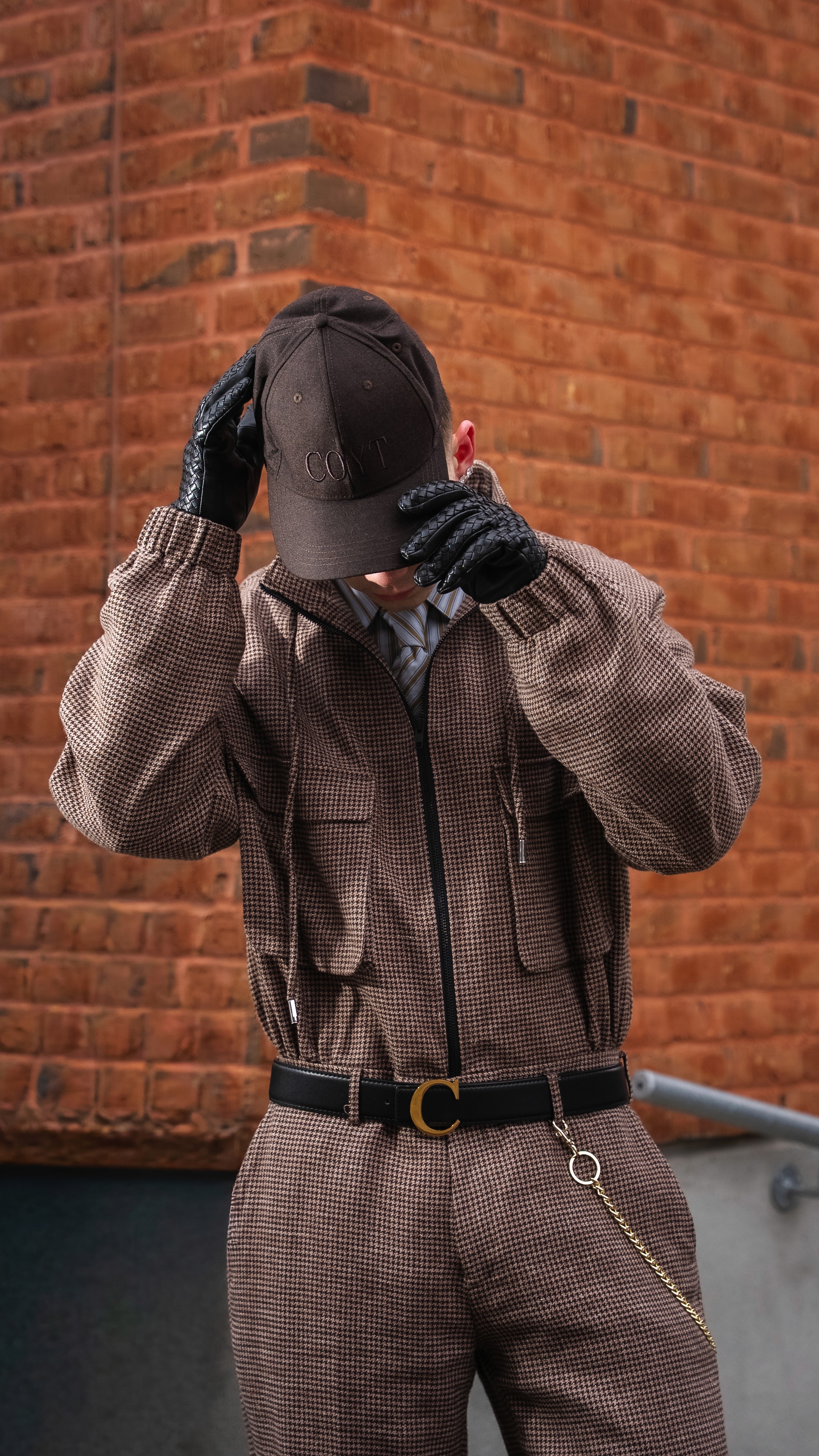 a woman in a red cape standing in the woods