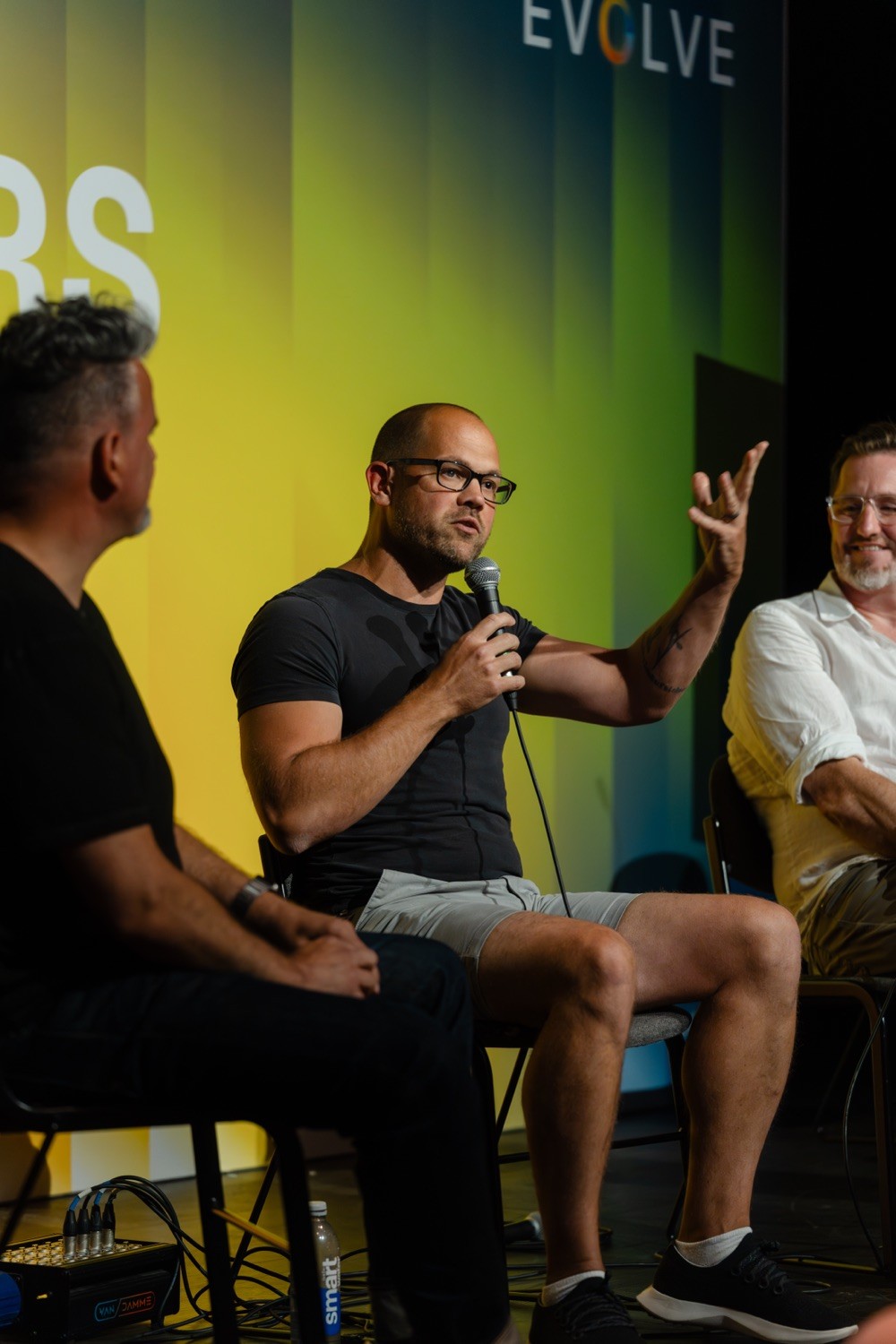 Panel speakers discussing innovation on stage at Evolve 26 Brighton conference