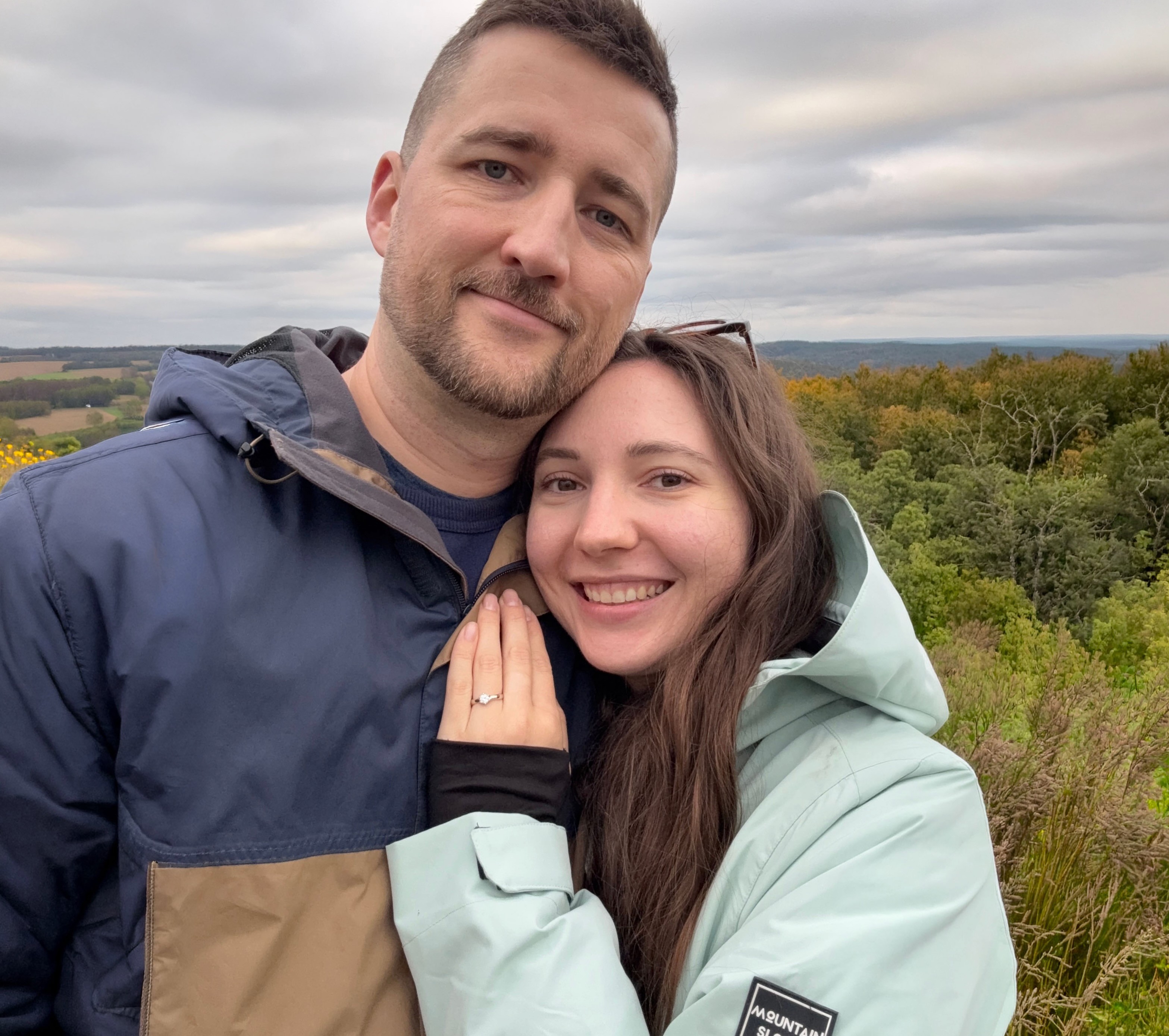 Couple holding hands running on the beach
