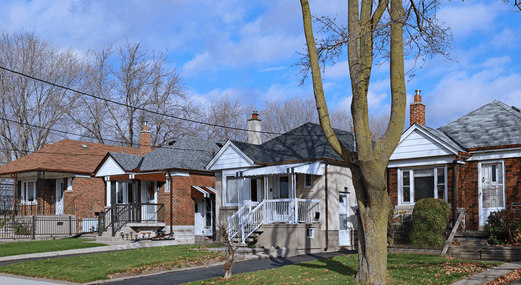 Portrait of a woman with digital pixelation and glitch effect over her face.