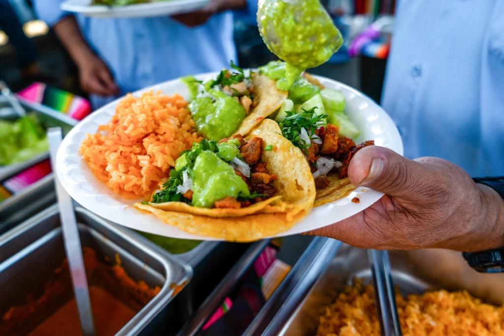 closeup photo of street tacos plate at a yard cookout