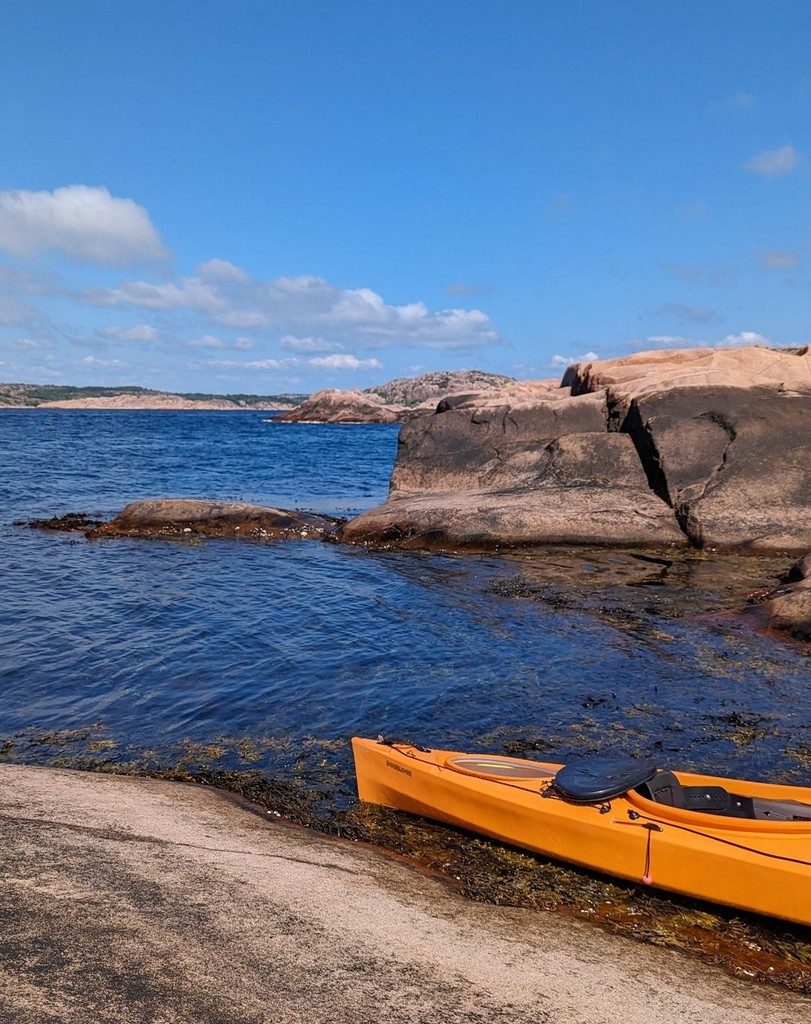 An orange kayak in a Swedish archipelago in West Sweden