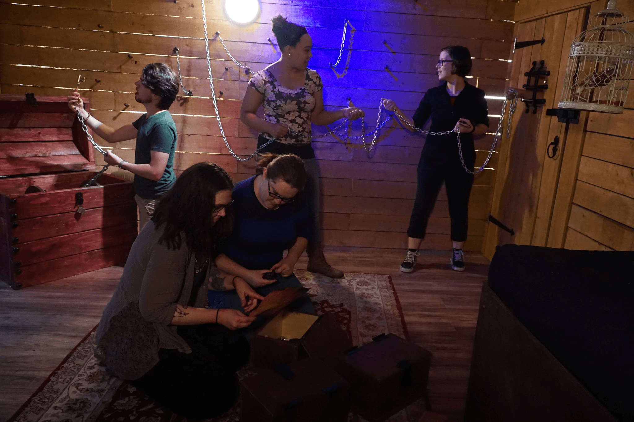 A group of people are solving puzzles in escape room