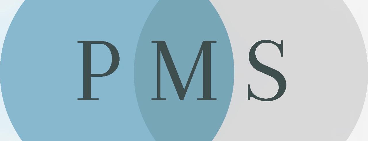 Close-up of lush, dark green leaves, some glossy and wet, against a muted background.