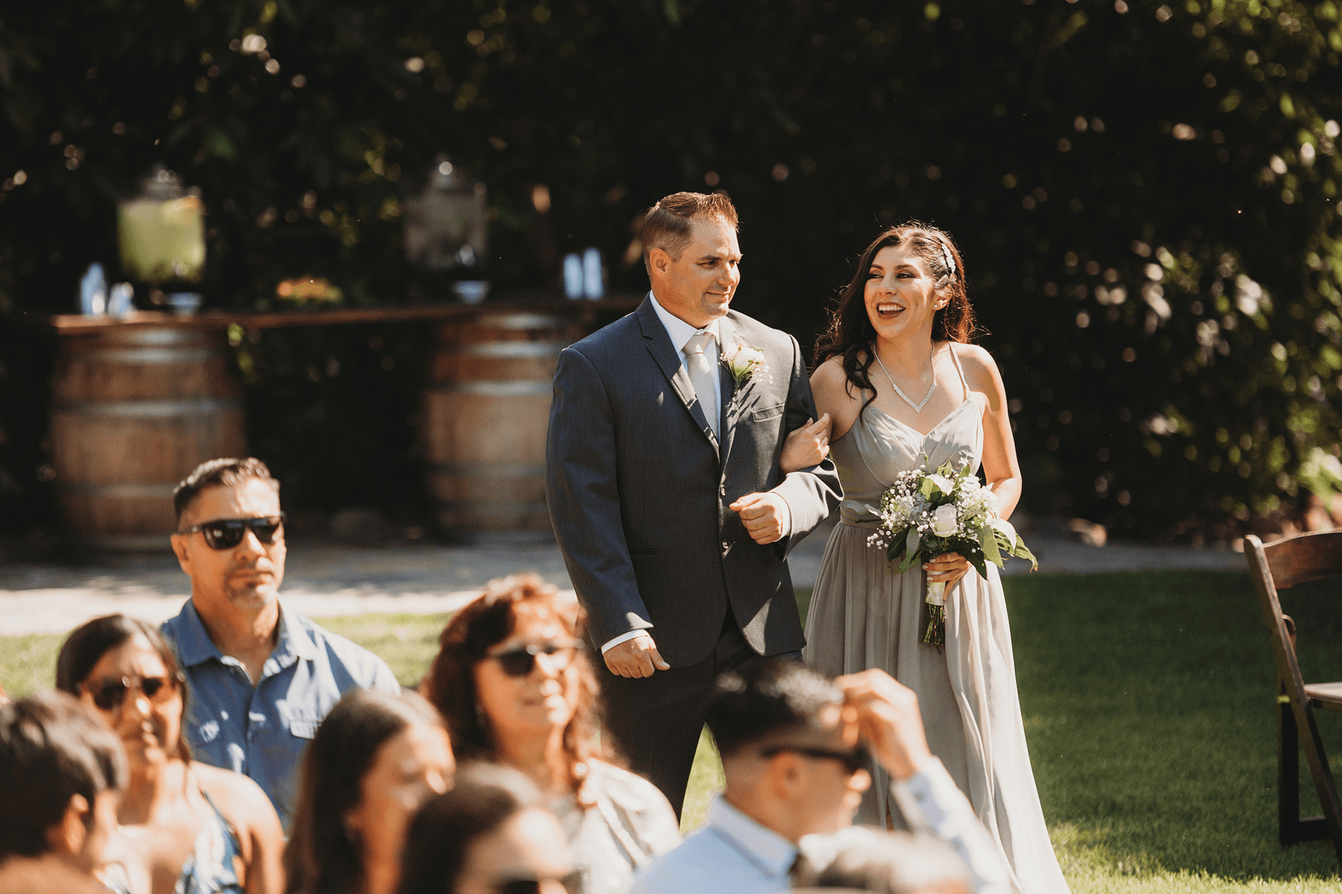 Flat lay wedding details with bouquet, rings, and sparkling bridal heels