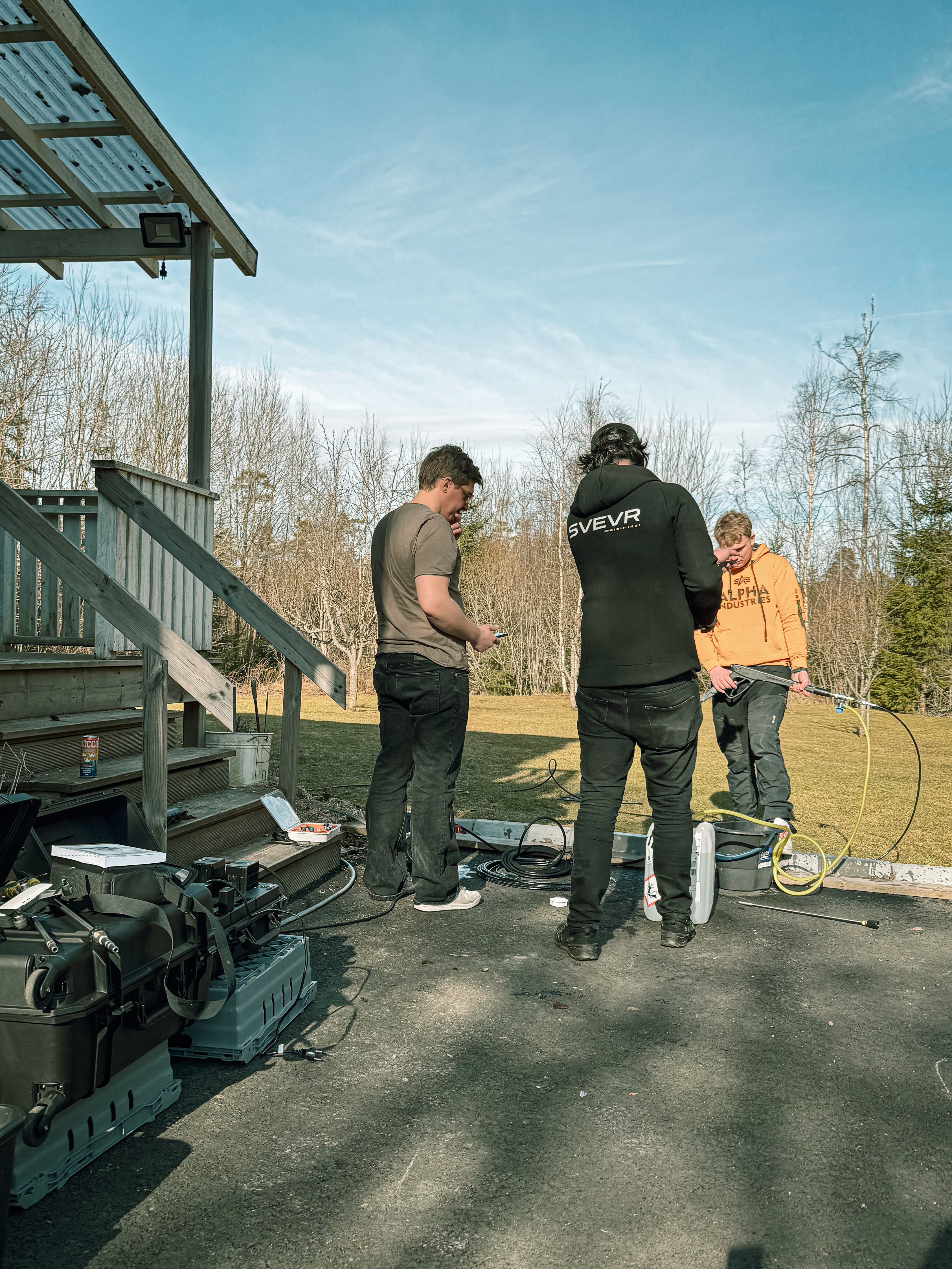 Close-up of vibrant purple flowers with droplets of water, creating a rich, textured background.