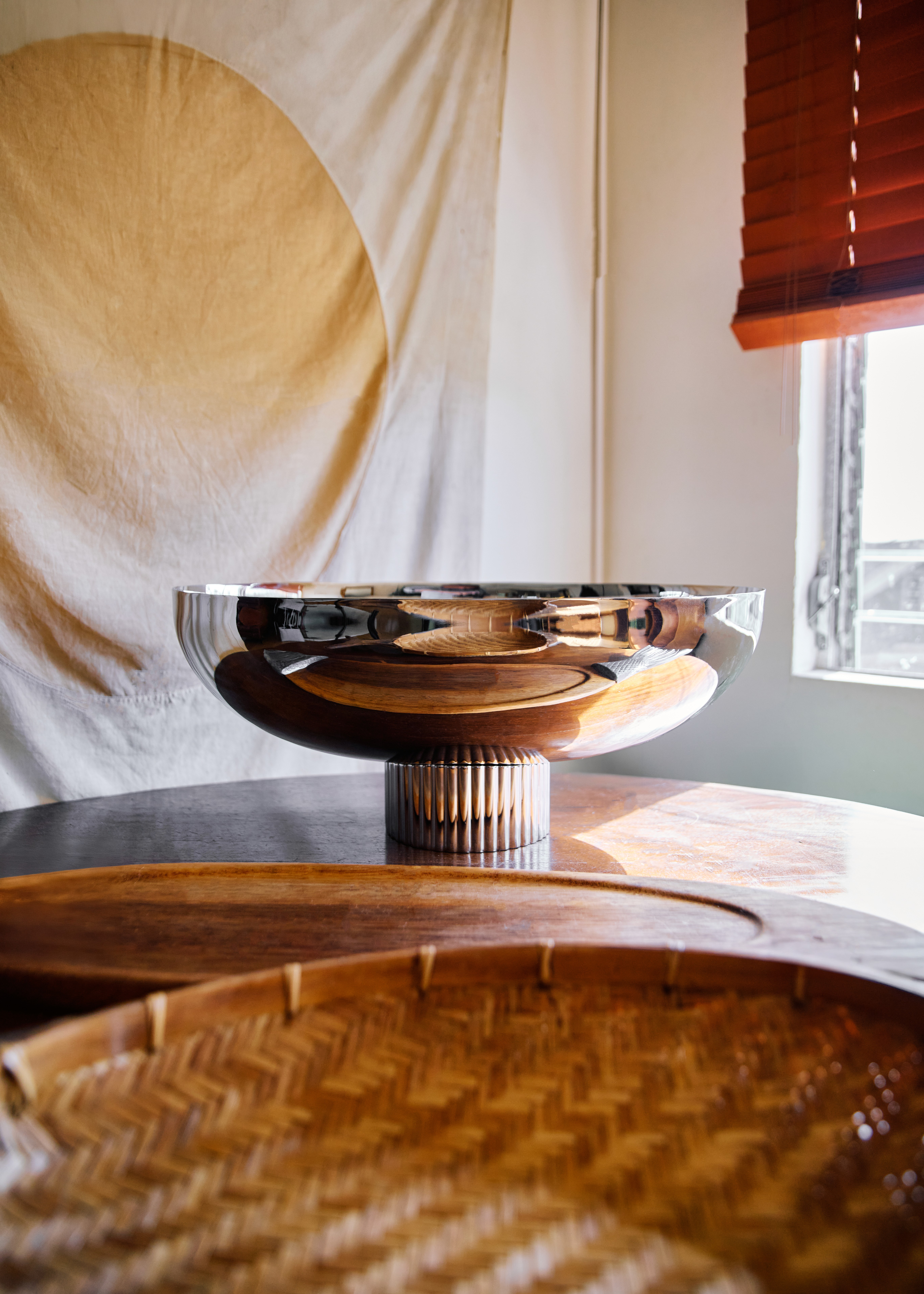 Woman walking on a curved pavement with shadow.