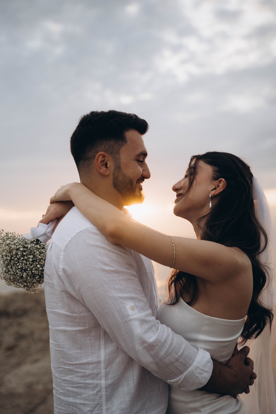 Sofia and Marcus smiling at each other in golden evening light
